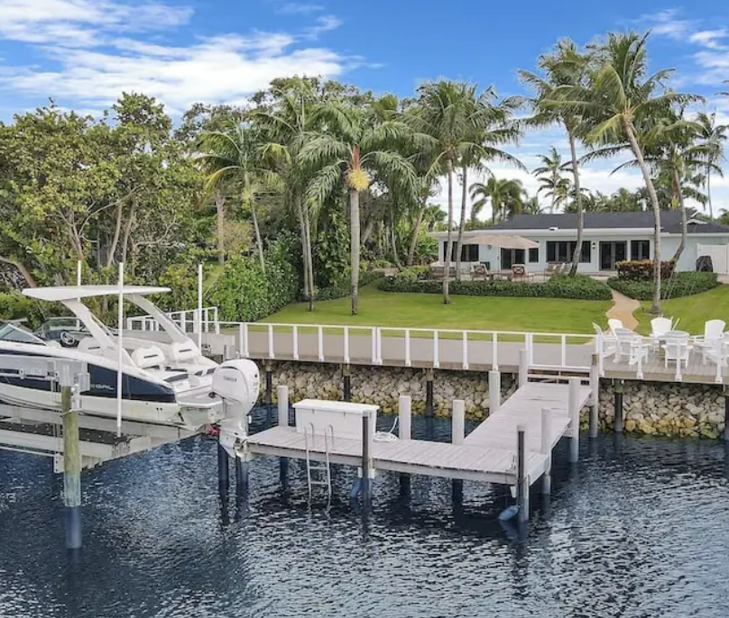 Lift-kept boat at a Delray Beach waterfront home